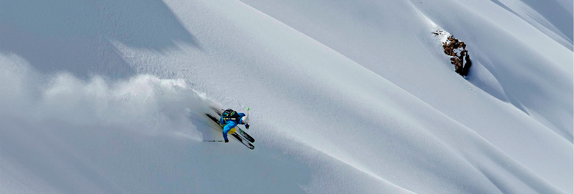 skier turning from above header