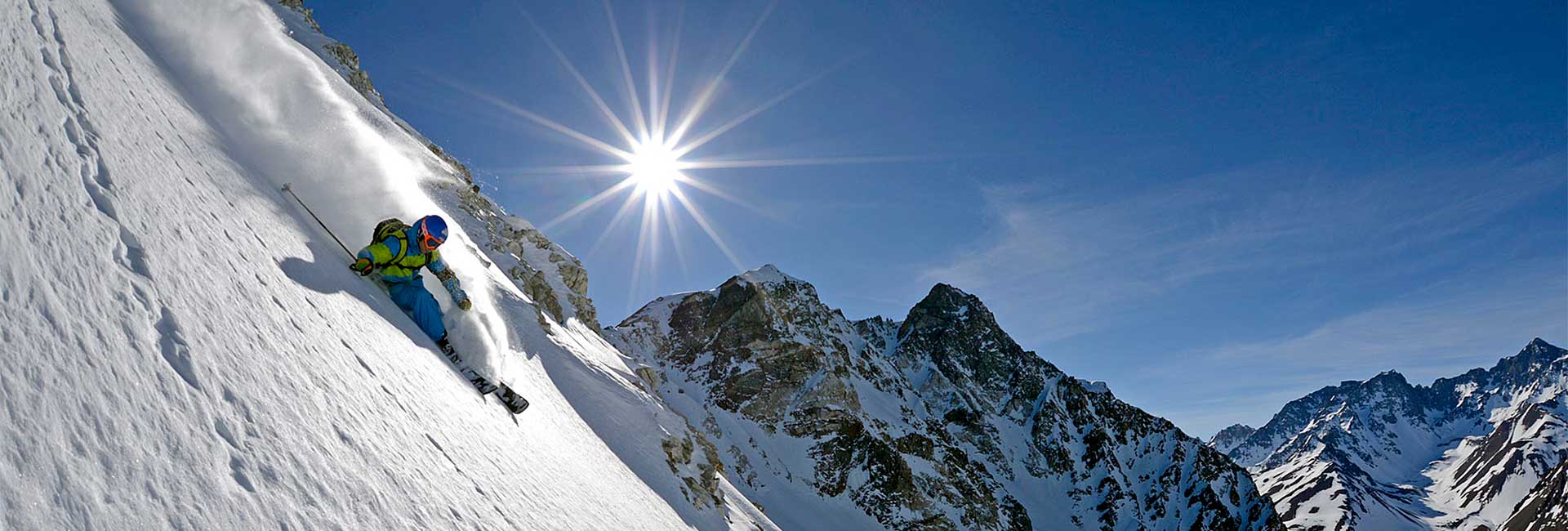 skier turning in sun header